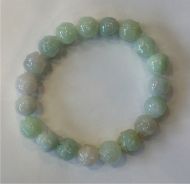 Elasticated bracelet with 8mm jade beads and lotus ﬂower